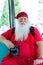 American Santa Claus in red summer suit