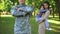 American serviceman in military uniform with wife and son behind, family defense