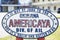 American shop sign where is inscribed Okinawa Americaya Div of ail it may re junk to you but it`s bread and butter to us in the