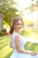 American smiling bride standing in garden.