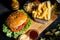 american stylish beef burger with grilled meat and mayo served with fries, coleslaw and beer