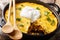 American Tamale corn pie crust and beef filling close-up in a pan. Horizontal