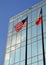 American and Texas flags in front of building