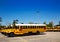 American typical school buses row in a parking lot