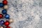 American USA patriotic flatlay Christmas holiday background with ornaments in red white and blue colors. Useful for Christmas in J