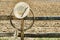 American West Rodeo Cowboy Hat and Lasso on Fence