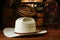 American West Rodeo Cowboy Hat and Old Ranch Tools