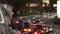 American wide multilane street intersection with traffic lights and moving cars at night. Transportation system in USA