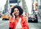 American woman making a phone call in Time Square