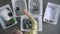 American woman sorts garbage into containers for recycling sitting on floor at home. Spbd