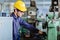 American worker young man.engineer smiling for service maintenance fix machine in heavy industy with safty suit and helmet