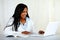 American young black woman working on laptop