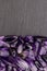 Amethyst heap stones texture on half black stone background. Place for text