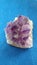 Amethyst stone over blue background