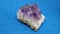 Amethyst stone over blue background