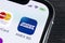Amex application icon on Apple iPhone X smartphone screen close-up. Amex app icon. American express is an online electronic financ