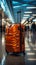 Amid the airport\\\'s commotion, a luggage bag blends into the blurred setting