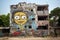 Amidst the devastation, artists transformed bombed ruins into poignant murals, reminding the world of the need for peace. An