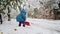 Amidst a fierce blizzard, a little child becomes a helper, shoveling through the difficult snowy path