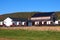 Amish Barn with Buggies Parked alongside