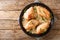 Amish chicken pieces baked in the flour and spices closeup in the plate. Horizontal top view