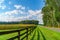 Amish country field agriculture, beautiful brown wooden fence, farm, barn in Lancaster, PA US