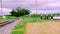 Amish Family Crossing Railroad Tracks on a Cloudy Summer Day