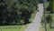 An amish horse and buggy riding along the road on the countryside