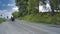 Amish Open Horse and Buggy Approaching With a Couple and Daughter in it