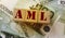 AML abbreviation stands for Anti Money laundering, on wooden blocks on 100 euro banknotes. No corruption concept