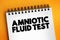 Amniotic Fluid Test is a medical procedure used primarily in the prenatal diagnosis of genetic conditions, text on notepad