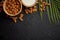 Amond seeds in wooden bowl, fresh natural milk placed on black stone background