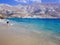 Amorgos, Greece-August 2,2017.The beutiful beach of Psili Ammos, with crystal clear waters and the port of Aegiali in the back.