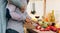 Amorous black couple cooking together in kitchen