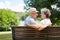 Amorous senior couple on a park bench