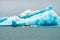 Amphibian vehicle with tourists in Jokulsarlon/Fjallsarlon glacier lagoon by the foot of Vatnajokull volcano.