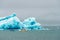 Amphibian vehicle with tourists in Jokulsarlon/Fjallsarlon glacier lagoon by the foot of Vatnajokull volcano.