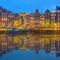 Amstel river, canals and night view of beautiful Amsterdam city. Netherlands