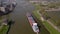 Amsterdam, 9th of May 2021, The Netherlands. Container ship and cargo vessel sailing through the Amsterdams rijnkanaal.