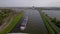 Amsterdam, 9th of May 2021, The Netherlands. Container ship and cargo vessel sailing through the Amsterdams rijnkanaal.