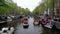 AMSTERDAM - APRIL 27, 2022: Huge traffic at Amsterdam channels during the Kingsday 2022 celebrations.