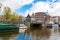 AMSTERDAM-APRIL 30: Amsterdam cityscape with famous Gunters and Meuser shop in the background.