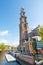 AMSTERDAM-APRIL 30: The bell tower of the Westerkerk as seen from the Prinsengracht canal on April 30,2015, the Netherlands.