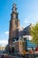 AMSTERDAM-APRIL 30: The bell tower of the Westerkerk seen from the Prinsengracht canal on April 30,2015, the Netherlands.