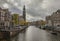 Amsterdam in autumn - traditional Dutch townhouses by a canal.