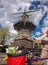 Amsterdam with basket of colorful tulips against old windmill in Holland