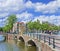 Amsterdam canal belt with ancient bridge and step gabled mansions, Amsterdam, Netherlands