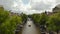 Amsterdam Canal Bridge with a Group of Tourists wearing Masks, Cityscape Crane Aerial