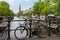 Amsterdam canal scene with bicycles and bridges