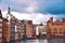 Amsterdam canal Singel with typical dutch houses and houseboats during morning blue hour, Holland, Netherlands. Used toning. Tradi